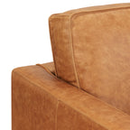 Fauteuil de salon moderne en cuir couleur cognac avec cadre en bois séché au four