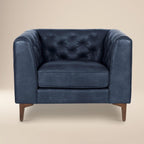 Fauteuil de salon en cuir bleu nuit, style classique moderne avec dossier capitonné