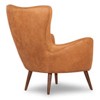 Fauteuil de salon traditionnel en cuir couleur cognac avec un cadre en bois séché au four