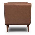 Fauteuil de salon moderne en cuir marron caramel avec dossier capitonné