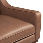 Fauteuil de salon moderne en cuir marron caramel avec dossier capitonné