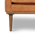 Fauteuil de salon moderne en cuir cognac avec dossier capitonné