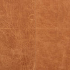 Fauteuil de salon moderne en cuir cognac avec dossier capitonné