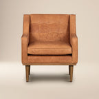 Fauteuil de salon moderne en cuir cognac avec dossier capitonné