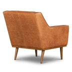 Fauteuil de salon moderne en cuir cognac avec dossier capitonné