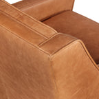 Fauteuil de salon moderne en cuir cognac avec dossier capitonné