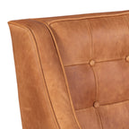 Fauteuil de salon moderne en cuir cognac avec dossier capitonné