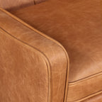 Fauteuil de salon moderne en cuir cognac avec dossier capitonné