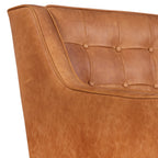 Fauteuil de salon moderne en cuir cognac avec dossier capitonné