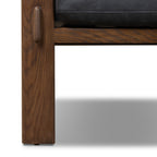 Fauteuil de salon moderne en cuir noir onyx avec dossier capitonné