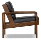 Fauteuil de salon moderne en cuir noir onyx avec dossier capitonné