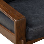 Fauteuil de salon moderne en cuir noir onyx avec dossier capitonné