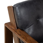 Fauteuil de salon moderne en cuir noir onyx avec dossier capitonné