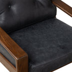 Fauteuil de salon moderne en cuir noir onyx avec dossier capitonné