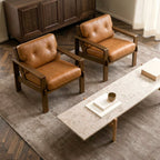 Fauteuil de salon moderne en cuir couleur cognac avec dossier capitonné