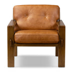 Fauteuil de salon moderne en cuir couleur cognac avec dossier capitonné