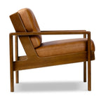 Fauteuil de salon moderne en cuir couleur cognac avec dossier capitonné