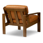 Fauteuil de salon moderne en cuir couleur cognac avec dossier capitonné