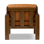 Fauteuil de salon moderne en cuir couleur cognac avec dossier capitonné